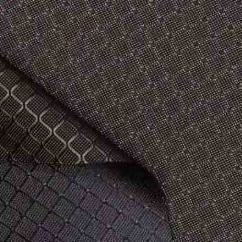 Close-up of black fabric with a visible square grid