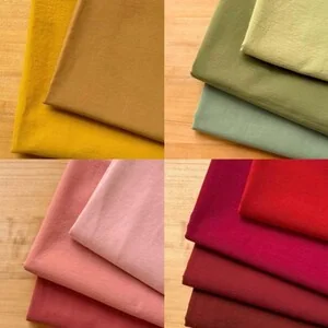 Washed cotton fabric swatches in muted colours
